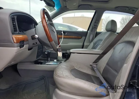 2002 Lincoln Continental z USA, uszkodzony, nr VIN 1LNHM97V62Y606545